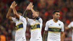 Soccer - Copa Libertadores - Group Stage - Group G - Athletico Paranaense v Boca Juniors - Arena da Baixada, Curitiba, Brazil - April 2, 2019   Boca Juniors&#039; Carlos Tevez looks dejected after the match while Emmanuel Mas and Dario Benedetto applaud fans after the match  REUTERS/Rodolfo Buhrer