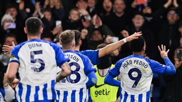 Brighton's Brazilian striker #09 Joao Pedro (R) celebrates after scoring his team fourth goal during the English Premier League football match between Brighton and Hove Albion and Tottenham Hotspur at the American Express Community Stadium in Brighton, southern England on December 28, 2023. (Photo by Glyn KIRK / AFP) / RESTRICTED TO EDITORIAL USE. No use with unauthorized audio, video, data, fixture lists, club/league logos or 'live' services. Online in-match use limited to 120 images. An additional 40 images may be used in extra time. No video emulation. Social media in-match use limited to 120 images. An additional 40 images may be used in extra time. No use in betting publications, games or single club/league/player publications. /