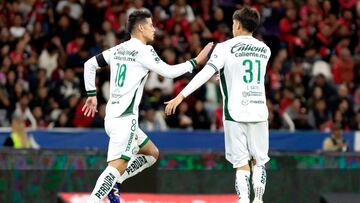 Leon's Colombian midfielder #10 James Rodríguez celebrates his team's goal with Leon's midfielder #31 Sebastian Santos during the Liga MX Clausura football match between Atlas and Leon at the Jalisco Stadium in Guadalajara, Jalisco State, Mexico on January 18, 2025. (Photo by ULISES RUIZ / AFP) (Photo by ULISES RUIZ/AFP via Getty Images)