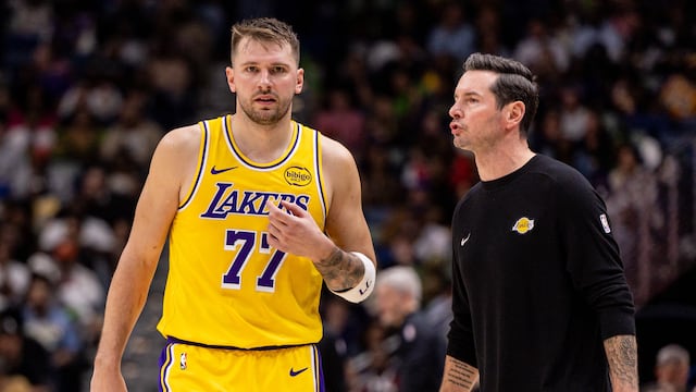 Jan 6, 2026; New Orleans, Louisiana, USA; Los Angeles Lakers forward/guard Luka Doncic (77) talks to Head Coach JJ Redick against the New Orleans Pelicans during the second half at Smoothie King Center. Mandatory Credit: Stephen Lew-Imagn Images