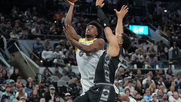 Dec 26, 2023; San Antonio, Texas, USA; Utah Jazz guard Collin Sexton (2) puts up a shot past San Antonio Spurs forward Keldon Johnson (3) in the first half at Frost Bank Center. Mandatory Credit: Daniel Dunn-USA TODAY Sports