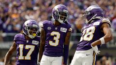 Jordan Addison #3 celebrates with Justin Jefferson #18 and K.J. Osborn #17 of the Minnesota Vikings after scoring a touchdown