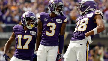 Jordan Addison #3 celebrates with Justin Jefferson #18 and K.J. Osborn #17 of the Minnesota Vikings after scoring a touchdown
