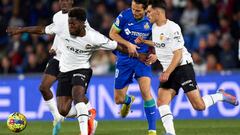 GETAFE, SPAIN - FEBRUARY 20: Enes Unal of Getafe CF battle for the ball with Yunus Musah of Valencia CF during the LaLiga Santander match between Getafe CF and Valencia CF at Coliseum Alfonso Perez on February 20, 2023 in Getafe, Spain. (Photo by Diego Souto/Quality Sport Images/Getty Images)