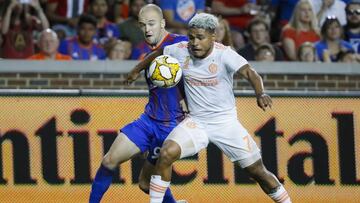 Atlanta United forward Josef Martinez (7) and FC Cincinnati defender Andrew Gutman (96) vie for the ball in the first half of an MLS soccer match, Wednesday, Sept. 18, 2019, in Cincinnati. (AP Photo/John Minchillo)