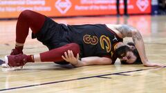 NEW ORLEANS, LOUISIANA - DECEMBER 28: Ricky Rubio #3 of the Cleveland Cavaliers holds his left knee after sustaining an injury during the fourth quarter of a NBA game against the New Orleans Pelicans at Smoothie King Center on December 28, 2021 in New Orl