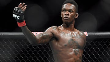 FILE - In this Feb. 10, 2019, file photo, Nigeria's Israel Adesanya poses as he fights Brazil's Anderson Silva in their middleweight bout at the UFC 234 mixed martial arts fights in Melbourne, Australia. Adesanya challenges champion Jan Blachowicz of Poland for the light heavyweight title in the main event of UFC 259 on Saturday in Las Vegas.  (AP Photo/Andy Brownbill, File)