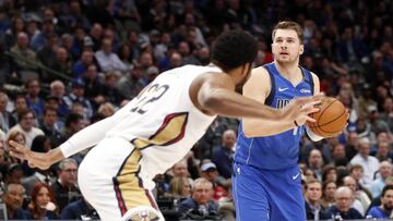 Mar 4, 2020; Dallas, Texas, USA;  Dallas Mavericks guard Luka Doncic (77) looks to shoot as New Orleans Pelicans center Derrick Favors (22) defends during the first quarter at American Airlines Center. Mandatory Credit: Kevin Jairaj-USA TODAY Sports