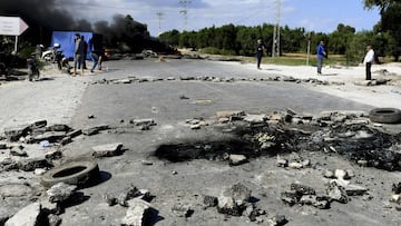 Tunisian youths burn tires and block the road leading to the city of Chebba on October 19, 2020 to protest against the decision of the Tunisian Football Federation to freeze the activities of CS Chebba football team from professional league 1, and to rele