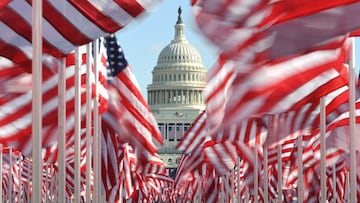 WASHINGTON, DC - JANUARY 19: The Capitol building is seen surrounded by American flags on the National Mall on January 19, 2021 in Washington, DC. Tight security measures are in place for Inauguration Day due to greater security threats after the attack o