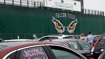 People gather at Groves High School prior to a caravan rally in support of a Black fellow student, who was jailed due to a probation violation of not keeping up with her online schoolwork, in the Detroit suburb of Beverly Hills, Michigan, U.S. July 16, 20