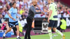 LONDON, ENGLAND - AUGUST 07: Pep Guardiola, Manager of Manchester City interacts with Erling Haaland as they are substituted during the Premier League match between West Ham United and Manchester City at London Stadium on August 07, 2022 in London, England. (Photo by Mike Hewitt/Getty Images)