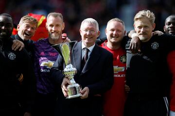 Soccer Football - 1999 Treble Reunion Match - Manchester United '99 Legends v Bayern Munich Legends - Old Trafford, Manchester, Britain - May 26, 2019  Manchester United manager Sir Alex Ferguson celebrates after the match with Peter Schmeichel, David May