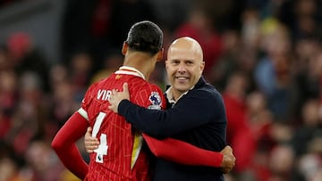 Soccer Football - Premier League - Liverpool v Chelsea - Anfield, Liverpool, Britain - October 20, 2024 Liverpool manager Arne Slot celebrates with Virgil van Dijk after the match REUTERS/Phil Noble EDITORIAL USE ONLY. NO USE WITH UNAUTHORIZED AUDIO, VIDEO, DATA, FIXTURE LISTS, CLUB/LEAGUE LOGOS OR 'LIVE' SERVICES. ONLINE IN-MATCH USE LIMITED TO 120 IMAGES, NO VIDEO EMULATION. NO USE IN BETTING, GAMES OR SINGLE CLUB/LEAGUE/PLAYER PUBLICATIONS. PLEASE CONTACT YOUR ACCOUNT REPRESENTATIVE FOR FURTHER DETAILS.. TPX IMAGES OF THE DAY
