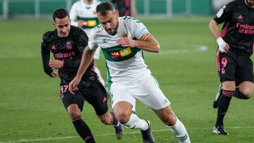 Lucas Vazquez of Real Madrid CF and Gonzalo Verdu of Elche CF in action during La Liga football match played between Elche CF and Real Madrid CF at Martinez Valero stadium on December 30, 2020 in Elche, Alicante, Spain.
 AFP7 
 30/12/2020 ONLY FOR USE IN 