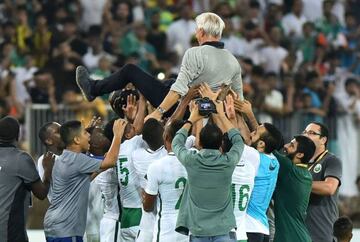 Saudi Arabia celebrate with Bert van Marwijk after World Cup qualification.