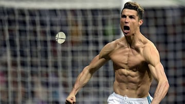 Real Madrid's Portuguese forward Cristiano Ronaldo celebrates after scoring a penalty during the UEFA Champions League quarter-final second leg football match between Real Madrid CF and Juventus FC at the Santiago Bernabeu stadium in Madrid on April