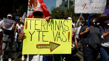 Anti-government protesters march against Mexican President Andres Manuel Lopez Obrador and the April 10 recall referendum on his presidency, in Mexico City, Mexico April 3, 2022. The placard reads “Finish your term and leave”. REUTERS/Gustavo Graf