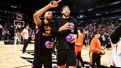 PHOENIX, AZ - APRIL 10: Mikal Bridges #25 of the Phoenix Suns and JaVale McGee #00 of the Phoenix Suns sign mini basketballs to hand out to fans after the game against the Sacramento Kings on April 10, 2022 at Footprint Center in Phoenix, Arizona. NOTE TO USER: User expressly acknowledges and agrees that, by downloading and or using this photograph, user is consenting to the terms and conditions of the Getty Images License Agreement. Mandatory Copyright Notice: Copyright 2022 NBAE (Photo by Barry Gossage/NBAE via Getty Images)