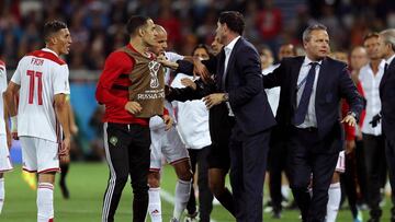 KALININGRAD, RUSSIA - JUNE 25: Faycal Fajr of Morocco confronts Fernando Hierro, Head coach of Spain after a VAR review leads to a goal by Iago Aspas of Spain being awarded during the 2018 FIFA World Cup Russia group B match between Spain and Morocco at