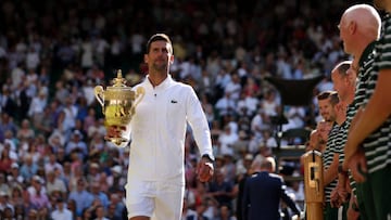 LONDON, ENGLAND - JULY 10: Novak Djokovic of Serbia looks on with the trophy following his victory against Nick Kyrgios of Australia in their Men's Singles Final match on day fourteen of The Championships Wimbledon 2022 at All England Lawn Tennis and Croquet Club on July 10, 2022 in London, England. (Photo by Clive Brunskill/Getty Images)