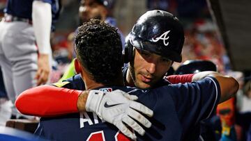 PHILADELPHIA, PENNSYLVANIA - SEPTEMBER 11: Matt Olson #28 of the Atlanta Braves is hugged by Orlando Arcia #11 after hitting a three-run home run against the Philadelphia Phillies during the third of game two of a doubleheader at Citizens Bank Park on September 11, 2023 in Philadelphia, Pennsylvania.   Rich Schultz/Getty Images/AFP (Photo by Rich Schultz / GETTY IMAGES NORTH AMERICA / Getty Images via AFP)