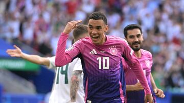 Germany's midfielder #10 Jamal Musiala (C) celebrates after scoring the opening goal during the UEFA Euro 2024 Group A football match between Germany and Hungary at the Stuttgart Arena in Stuttgart on June 19, 2024. (Photo by DAMIEN MEYER / AFP)