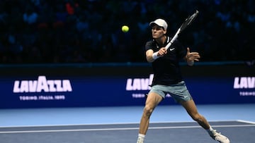 Italy's Jannik Sinner hits a return to Australia's Alex de Minaur during their match at the ATP Finals tennis tournament in Turin on November 10, 2024. (Photo by Marco BERTORELLO / AFP)
