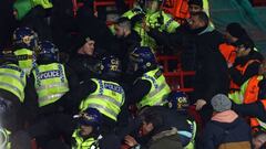 Police wade into the Betis fans during the UEFA Europa league round of 16 first leg football match between Manchester United and Real Betis at Old Trafford stadium in Manchester, north-west England, on March 9, 2023. (Photo by DARREN STAPLES / AFP) (Photo by DARREN STAPLES/AFP via Getty Images)