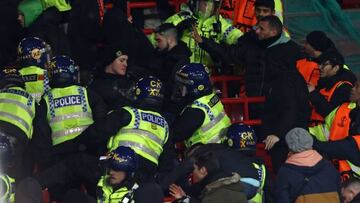 Police wade into the Betis fans during the UEFA Europa league round of 16 first leg football match between Manchester United and Real Betis at Old Trafford stadium in Manchester, north-west England, on March 9, 2023. (Photo by DARREN STAPLES / AFP) (Photo by DARREN STAPLES/AFP via Getty Images)