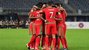 Oman's players celebrate after scoring a goal during the 2017 Gulf Cup of Nations semi-final football match between Oman and Bahrain at the Sheikh Jaber al-Ahmad Stadium in Kuwait City on January 2, 2018. / AFP PHOTO / GIUSEPPE CACACE