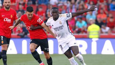 Real Mallorca�s Spanish midfielder #14 Daniel Rodriguez (L) vies with Real Madrid's French defender #23 Ferland Mendy during the Spanish league football match between RCD Mallorca and Real Madrid CF at the Mallorca Son Moix stadium in Palma de Mallorca on April 13, 2024. (Photo by JAIME REINA / AFP)