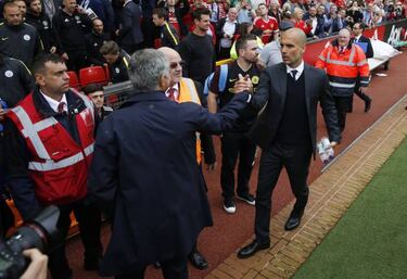 Pep Guardiola and José Mourinho give the world a hug