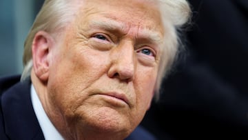 U.S. President Donald Trump looks on, as he signs executive orders in the Oval Office of the White House in Washington, U.S., February 10, 2025. REUTERS/Kevin Lamarque