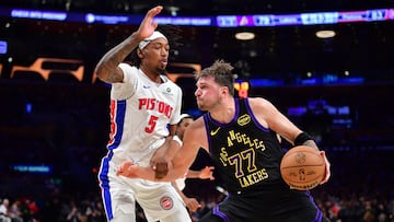 Dec 30, 2025; Los Angeles, California, USA; Los Angeles Lakers guard Luka Doncic (77) moves the ball against Detroit Pistons forward Ronald Holland II (5) during the second half at Crypto.com Arena. Mandatory Credit: Gary A. Vasquez-Imagn Images