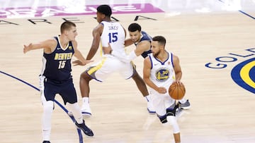 Nikola Jokic of the Denver Nuggets defends as Stephen Curry of the Golden State Warriors drives the ball during the first quarter of their NBA pre-season game at Oracle Arena in Oakland, California, U.S., September 30, 2017. REUTERS/Stephen Lam