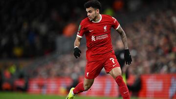 Liverpool's Colombian midfielder #07 Luis Diaz runs with the ball during the English League Cup semi-final first leg football match between Liverpool and Fulham at Anfield in Liverpool, north west England on January 10, 2024. (Photo by Paul ELLIS / AFP) / RESTRICTED TO EDITORIAL USE. No use with unauthorized audio, video, data, fixture lists, club/league logos or 'live' services. Online in-match use limited to 120 images. An additional 40 images may be used in extra time. No video emulation. Social media in-match use limited to 120 images. An additional 40 images may be used in extra time. No use in betting publications, games or single club/league/player publications. /