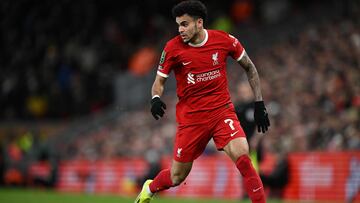 Liverpool's Colombian midfielder #07 Luis Diaz runs with the ball during the English League Cup semi-final first leg football match between Liverpool and Fulham at Anfield in Liverpool, north west England on January 10, 2024. (Photo by Paul ELLIS / AFP) / RESTRICTED TO EDITORIAL USE. No use with unauthorized audio, video, data, fixture lists, club/league logos or 'live' services. Online in-match use limited to 120 images. An additional 40 images may be used in extra time. No video emulation. Social media in-match use limited to 120 images. An additional 40 images may be used in extra time. No use in betting publications, games or single club/league/player publications. / 