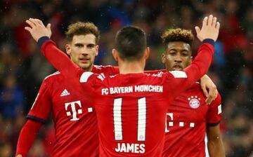 Bayern Munich's Kingsley Coman celebrates scoring their third goal with James Rodriguez.