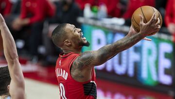 Portland Trail Blazers guard Damian Lillard, right, shoots in front of Memphis Grizzlies guard Grayson Allen during the first half of an NBA basketball game in Portland, Ore., Friday, April 23, 2021. (AP Photo/Craig Mitchelldyer)