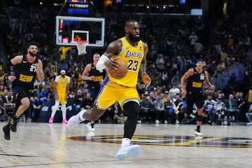 LeBron James (23) drives to the net in the second quarter against the Denver Nuggets.