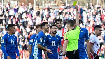 Real Betis' Spanish defender Alex Moreno (4L) is sent off after fouling Rayo Vallecano's Spanish forward Isi Palazon during the Spanish league football match between Rayo Vallecano de Madrid and Real Betis at the Vallecas stadium in Madrid on Ja