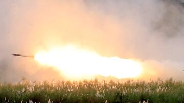 US military forces fire a High Mobility Artillery Rocket System (HIMARS) rocket during the annual  Philippines-US live fire amphibious landing exercise (PHIBLEX) at Crow Valley in Capas, Tarlac province, north of Manila.