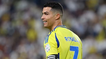 Nassr's Portuguese forward #7 Cristiano Ronaldo looks on during the Saudi Pro League football match between Al-Nassr and Al-Qadsiah at Al-Awwal Park in Riyadh on November 22, 2024. (Photo by Fayez NURELDINE / AFP)