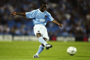 MANCHESTER - AUGUST 14: Shaun Wright-Phillips of Manchester City scores the second goal of the match during the UEFA Cup qualifying round first leg match between Manchester City and Total Network Solutions held on August 14, 2003 at the City of Manchester Stadium, in Manchester, England. Manchester City won the match 5-0. (Photo by Alex Livesey/Getty Images)