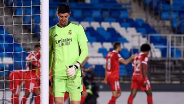 (FILES) Real Madrid's Belgian goalkeeper Thibaut Courtois reacts to Sevilla's second goal scored by Sevilla's Croatian midfielder Ivan Rakitic during the Spanish League football match between Real Madrid CF and Sevilla FC at the Alfredo di Stefano stadium in Valdebebas, on the outskirts of Madrid on May 9, 2021. Real Madrid's goalkeeper Thibaut Courtois has ruptured the anterior cruciate ligament in his left knee on the eve of the new season in La Liga, his club announced on August 10, 2023. (Photo by PIERRE-PHILIPPE MARCOU / AFP)