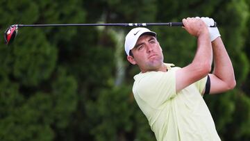 Scottie Scheffler of the United States plays his shot from the ninth tee during the first round of the Travelers Championship at TPC River Highlands