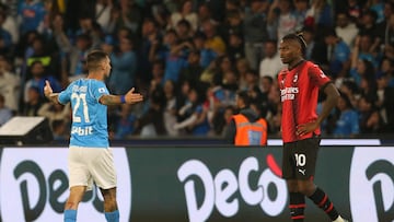 Napoli's Italian forward #21 Matteo Politano celebrates next to AC Milan's Portuguese forward #10 Rafael Leao after scoring the team's first goal during the Italian Serie A football match between Napoli and AC Milan on October 29, 2023 at the Diego Armando Maradona stadium in Naples. (Photo by Carlo Hermann / AFP)