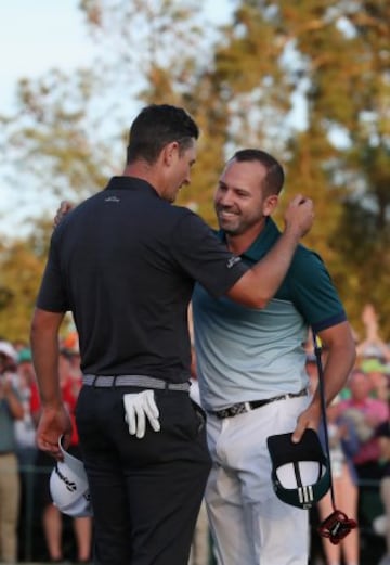 Justin Rose congratulates Sergio Garcia.