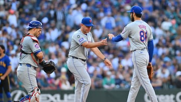 Aug 11, 2024; Seattle, Washington, USA; New York Mets manager Carlos Mendoza (64) pulls relief pitcher Danny Young (81) from the game during the seventh inning against the Seattle Mariners at T-Mobile Park. Mandatory Credit: Steven Bisig-USA TODAY Sports